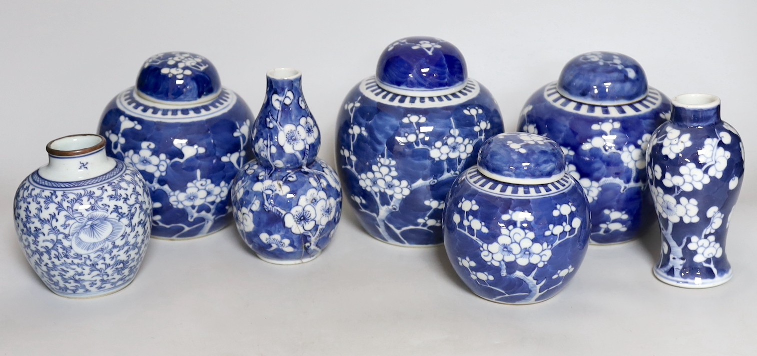 Four Chinese blue and white prunus pattern ginger jars, together with three similar vases. 19th/early 20th century, Tallest 15cm